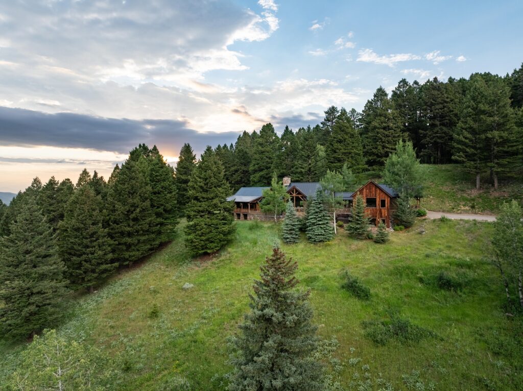 Mountain cabin surrounded by evergreen trees near Bozeman, Montana
