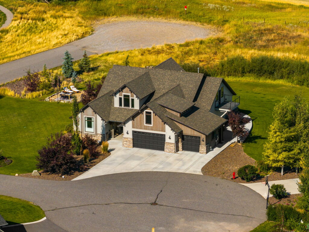 Aerial view of a luxury home on open Montana acreage