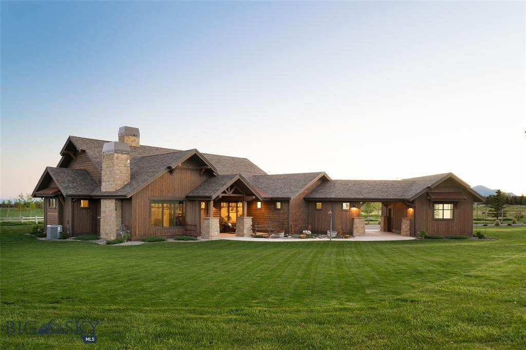 Sprawling luxury estate on open Montana land at dusk
